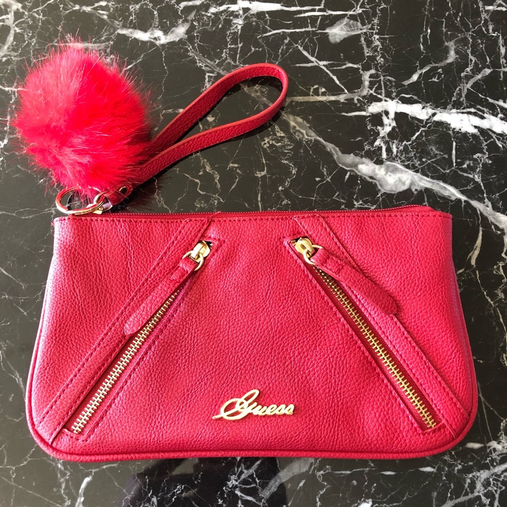 Guess wristlet with Pom Pom